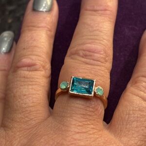 Custom ring with blue and white stones 
Size 8